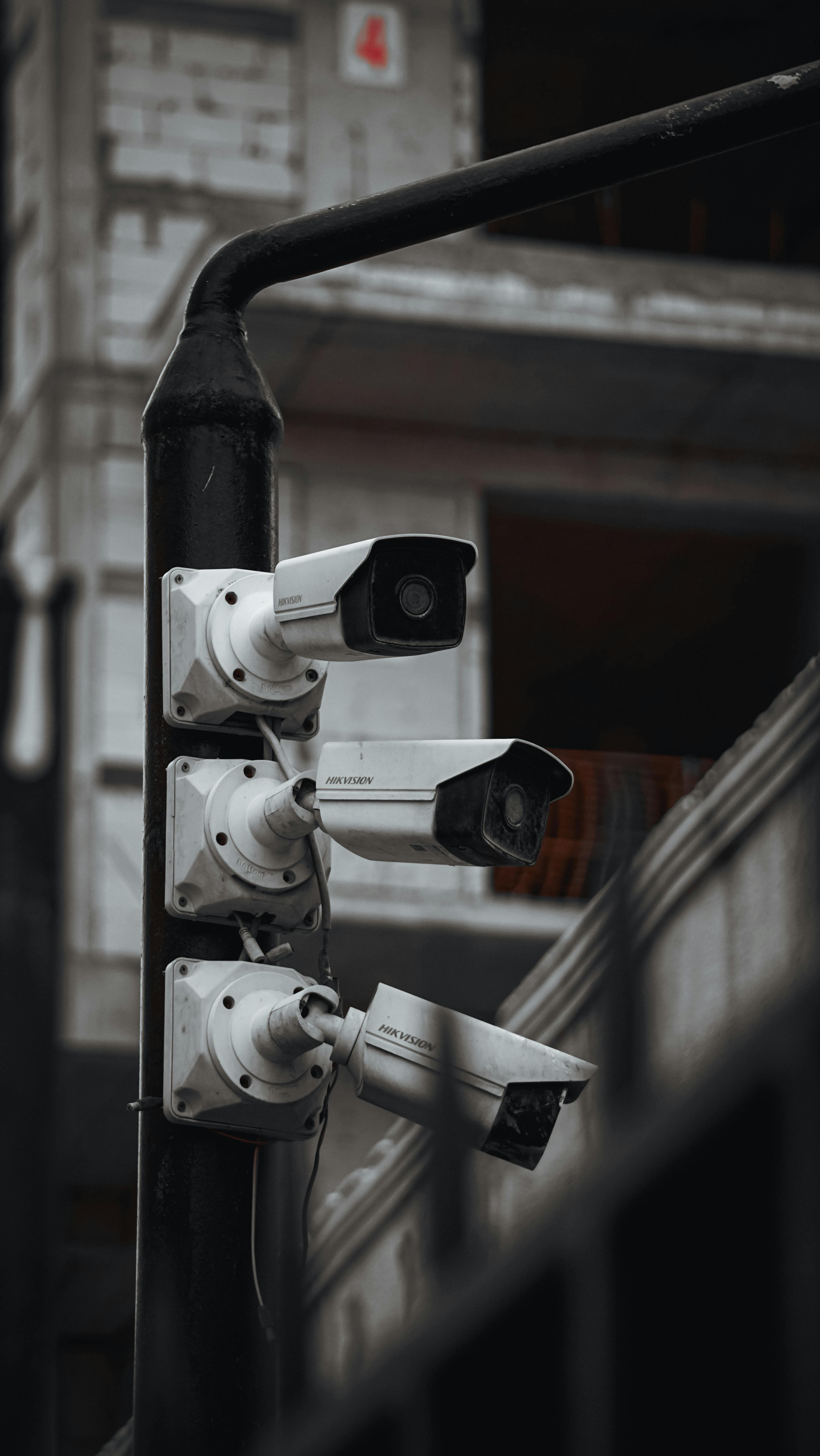 Security cameras mounted on a pole outside a building