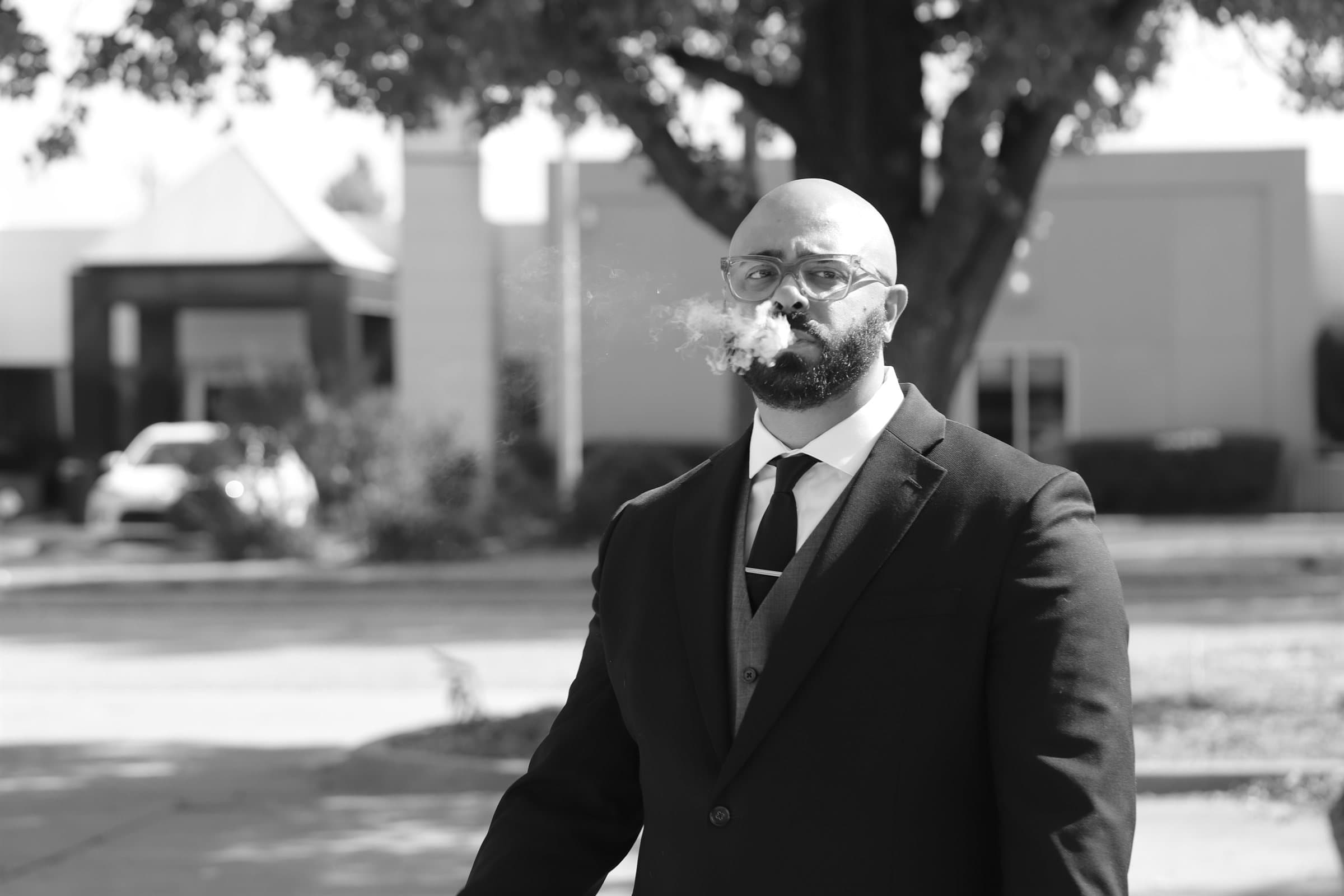 Alaric Brito, Program Director at SCOPE, in a dark suit outdoors